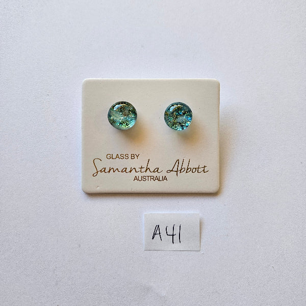 Pair of green earrings on a branded card with 'Samantha Abbott' on a white background