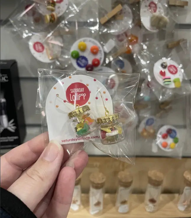 Saturday Lollipop lolly jar earrings held in store packaging — Adventure Awaits