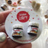 Mini Nutella jar stud earrings on a Saturday Lollipop display card, Adventure Awaits