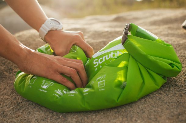 green scrubba bag in use 