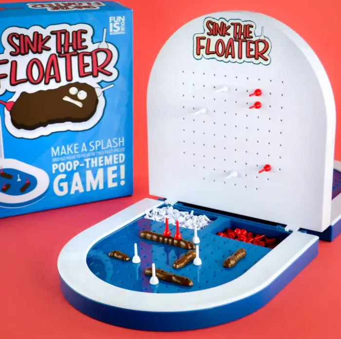 Sink the Floater poop-themed tabletop game with blue and white board, pegs and floating pieces — Adventure Awaits