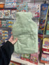 Back of mint green Starr & Rose sloth plush mini hot water bottle in packaging — Adventure Awaits