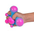 Hand squeezing blue and pink spiky sensory stress ball with stretchy tactile bubble texture