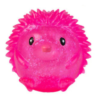 Bright pink glowing echidna shaped squishy sensory toy with spiky texture and cute face