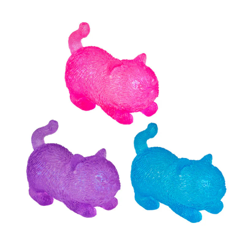 Pink, purple and blue translucent cat squishy toys with curled tails — Adventure Awaits