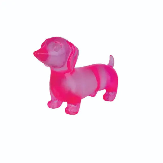Pink translucent dachshund squishy toy on white background — Adventure Awaits