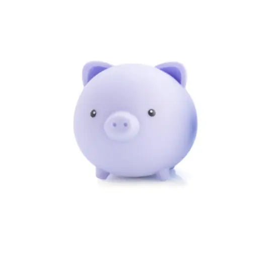 Pastel purple pig shaped squishy sensory toy with cute face and soft rounded design