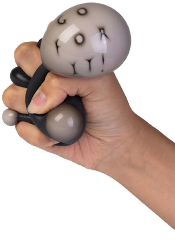 Hand squeezing a Magic Fortune Ball stress toy revealing the words GO FOR IT through the surface