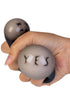 Hand squeezing a colour changing Magic Fortune Ball stress toy revealing the word YES