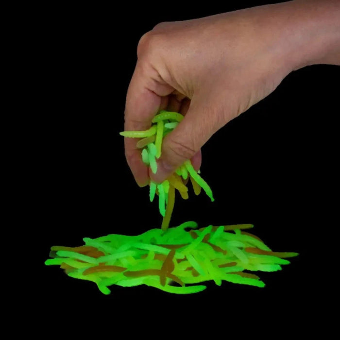 Smooshos glow in the dark stretchy worms glowing green in hand — Adventure Awaits