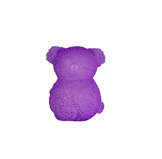 Purple koala squishy toy with textured fur detail on white background — Adventure Awaits
