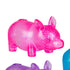 Three colorful rhino figurines in pink, purple, and blue on a white background