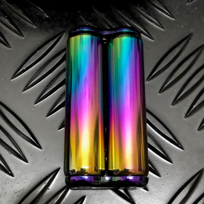 iridescent rainbow coloured Kaiko dual hand roller sensory tool on a textured black surface