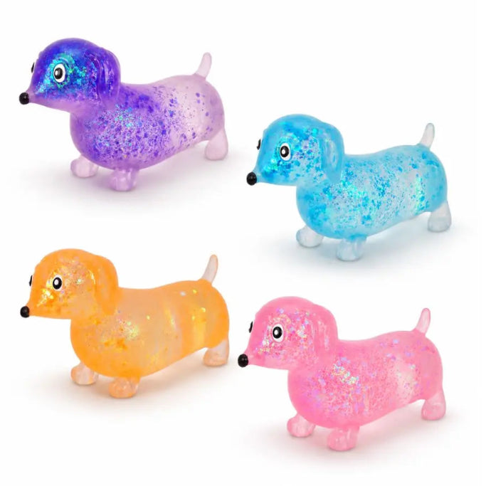 Sparkly Sausage Dog squishy toys in purple, blue, orange and pink with glitter-filled bodies — Adventure Awaits
