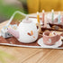 Wooden tea set with pink cup and teapot on play mat, sweet pretend play toy — Adventure Awaits