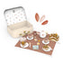 Wooden tea party suitcase set with cake, cups and teapot on floral play mat — Adventure Awaits