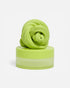 Lime green SPEKS Blur calming focus putty twisted on its matching storage tub — Adventure Awaits