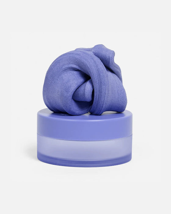 Purple SPEKS Blur calming focus putty twisted on its matching storage tub — Adventure Awaits