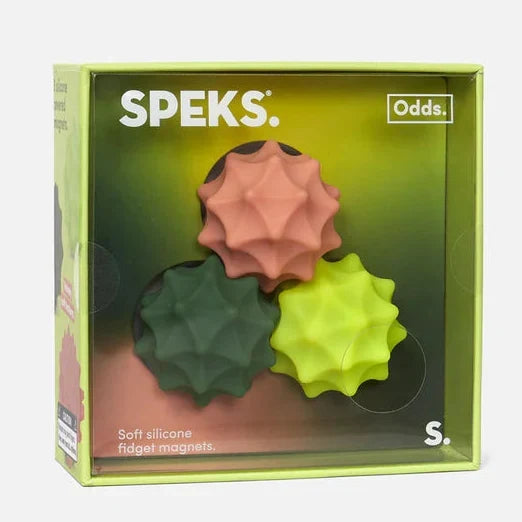 Speks Odds S soft silicone fidget magnets in a lime green retail box, showing three textured star-shaped magnets in pink, dark green, and neon yellow-green.