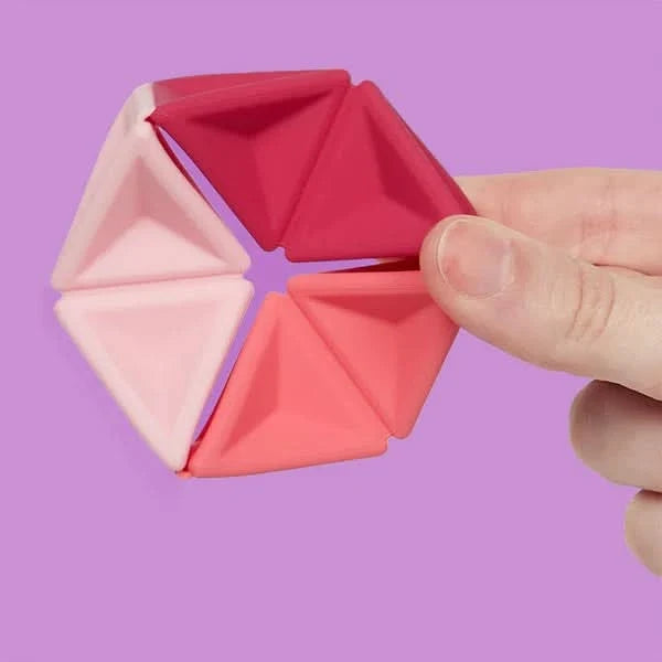 Speks Pivot Magenta silicone hexaflexagon fidget toy in pink and coral triangles