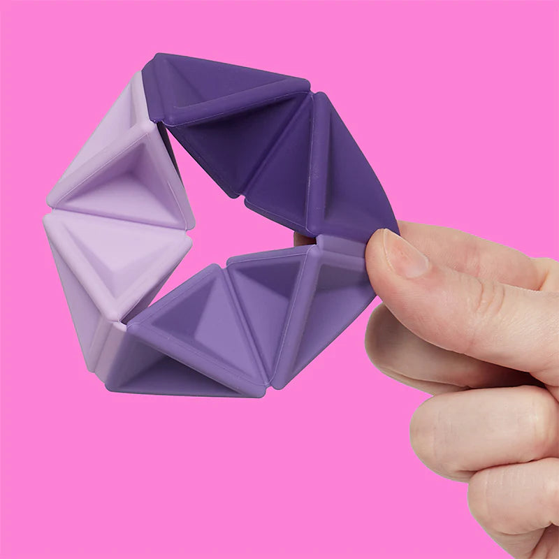 Speks Pivot Violet silicone hexaflexagon fidget toy folded open into a hexagon