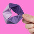 Speks Pivot Violet silicone hexaflexagon fidget toy folded open into a hexagon