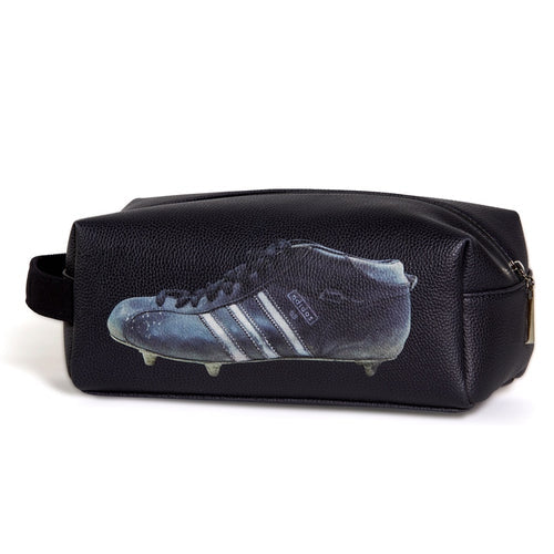 Black football wash bag with vintage football boot print and zip closure — Adventure Awaits