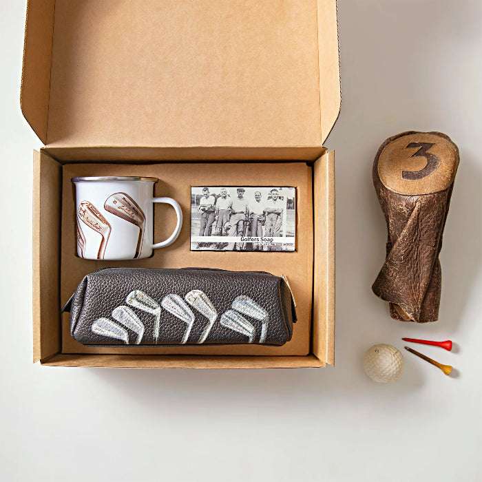 The Golfers Gift set with enamel mug, golfers soap and golf club wash bag beside a vintage wood cover, golf ball and tees — Adventure Awaits