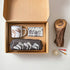 The Golfers Gift set with enamel mug, golfers soap and golf club wash bag beside a vintage wood cover, golf ball and tees — Adventure Awaits