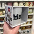 Vintage netball bib mug in illustrated Sporting Nation gift box, held in a shop — Adventure Awaits