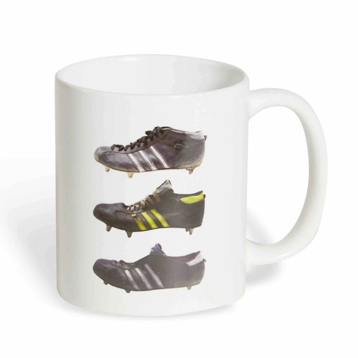 Sporting Nation white coffee mug with three vintage football boot designs — Adventure Awaits