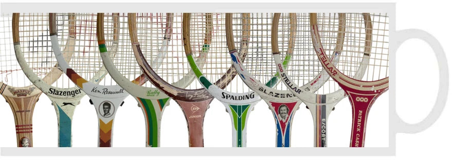 White ceramic tennis mug decorated with a row of vintage racquets — Adventure Awaits