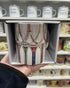Vintage tennis racquet mug in gift box, held in front of a shop display — Adventure Awaits