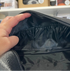 Open black football toiletry bag showing lined interior with elastic storage pockets — Adventure Awaits