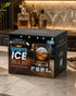 A black product box for Men's Republic Sports Ice Trays sits on a marble countertop with a blurred bar scene in the background. The box features a photo of an ice cube melting in an amber drink and colorful text reading 'SPORTS ICE TRAYS'.