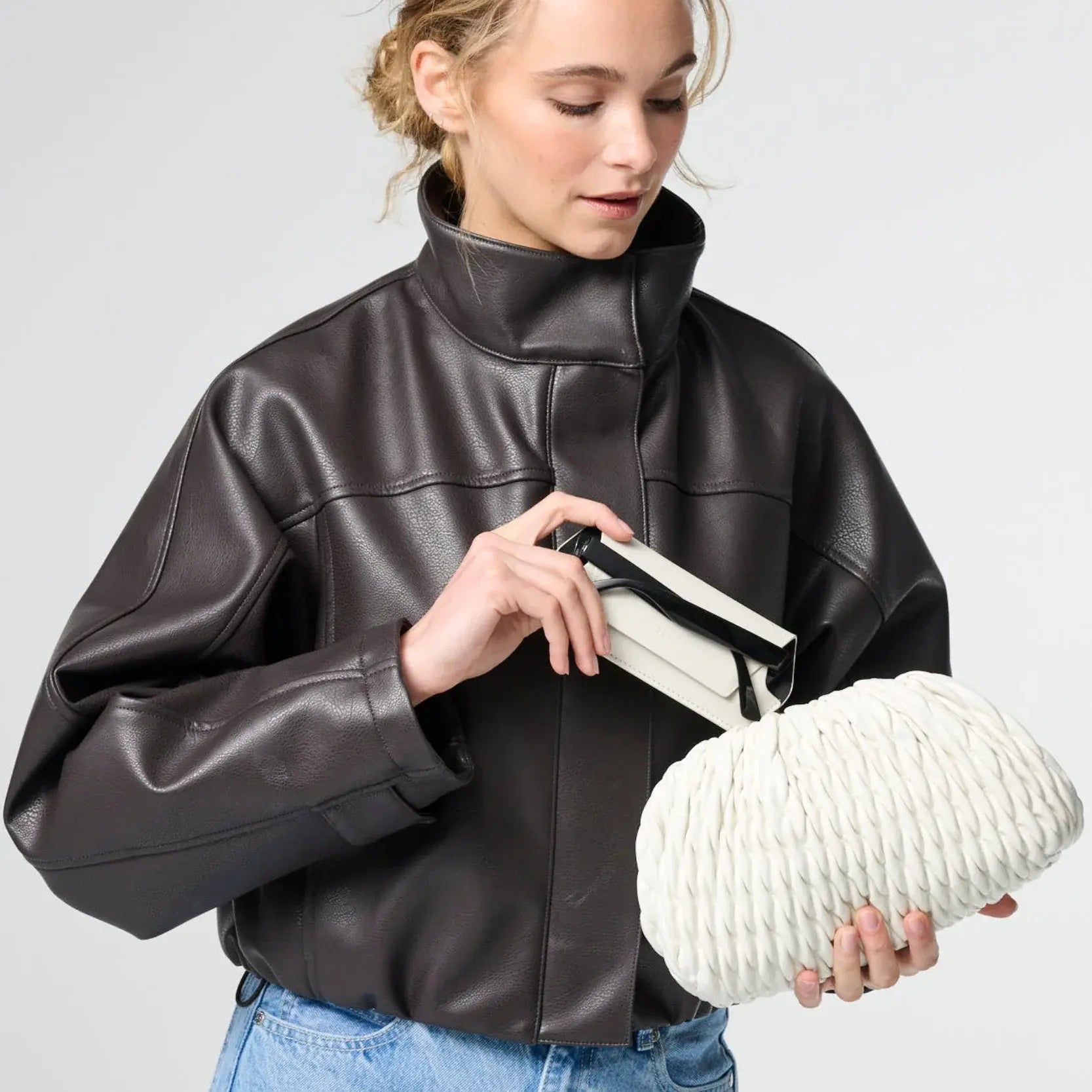 lady holding stone glasses case