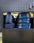 Navigator Buddy bags stacked in a caravan aluminium storage compartment — perfectly organised caravanning gear — Adventure Awaits