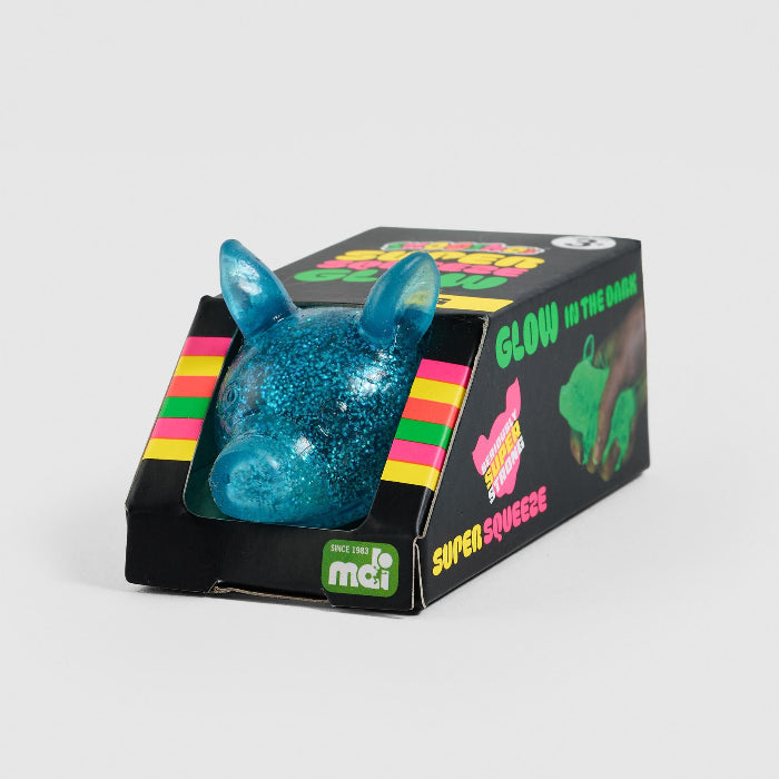 Blue glittery toy pig in a black box with colorful text on a white background