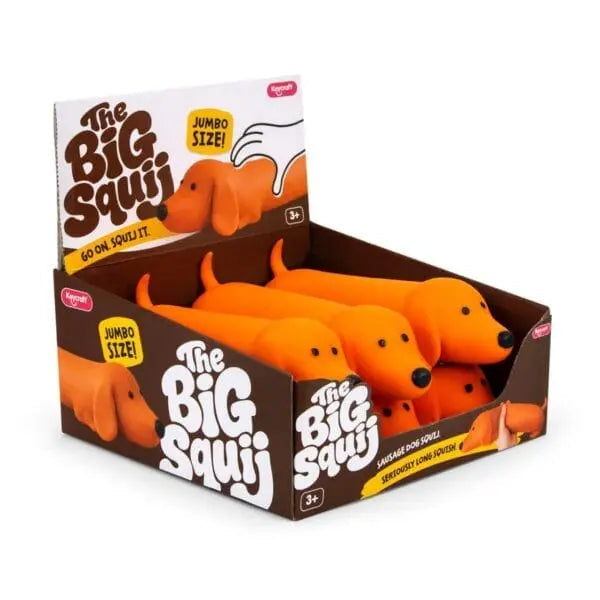 The Big Squii jumbo sausage dog squishy toys in bright orange retail display box — Adventure Awaits