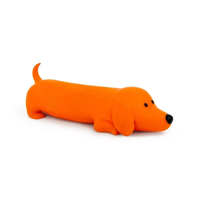 The Big Squii jumbo sausage dog squishy in bright orange with floppy ears and black nose — Adventure Awaits