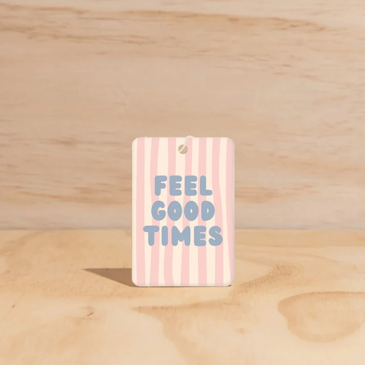 The Commonfolk Feel Good Times boho hanging air freshener with Mali scent of coconut & lime on a light timber background — Adventure Awaits