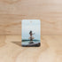 The Commonfolk Hula Girl boho hanging air freshener with Ubud scent of agarwood, musk & patchouli on a light timber background — Adventure Awaits