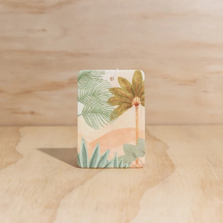 The Commonfolk The Landscape boho hanging air freshener with Ubud scent of agarwood, musk & patchouli on a light timber background — Adventure Awaits