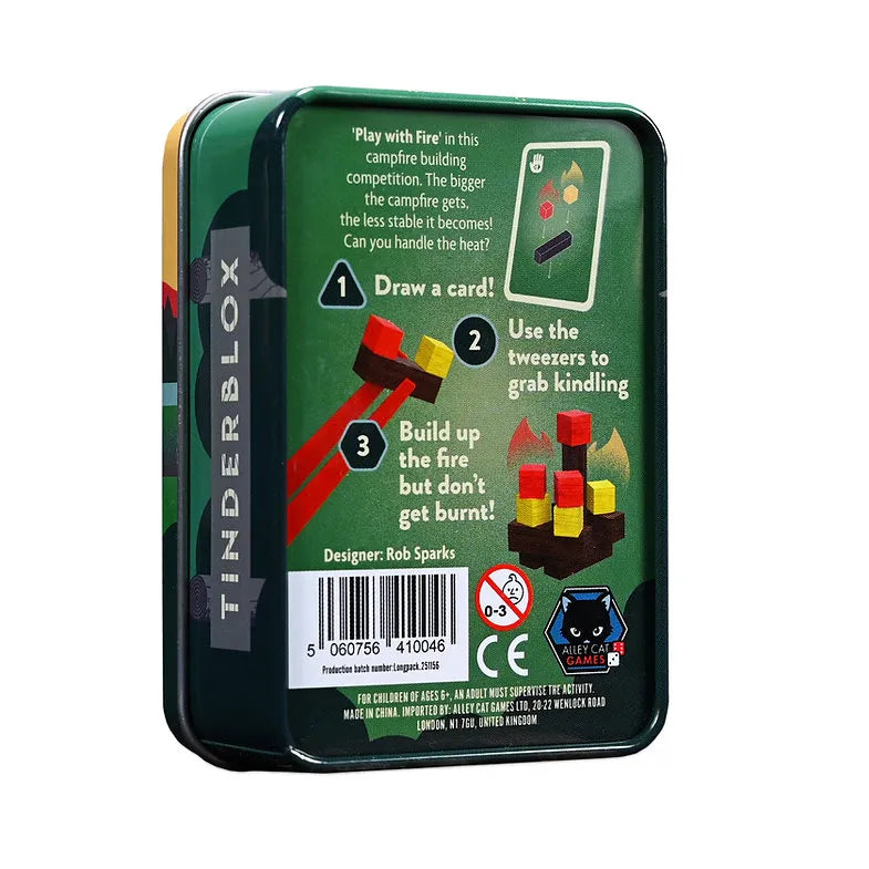 TinderBlox campfire building game in a square metal tin, showing the back of the packaging with instructions, a barcode, and product graphics on a white background.