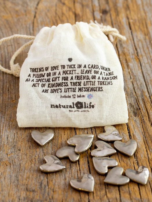 Tiny Tokens of Love bag back with silver heart keepsakes and message card idea — Adventure Awaits