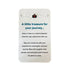 Travel keepsake card with red enamel suitcase charm and journey message — Adventure Awaits