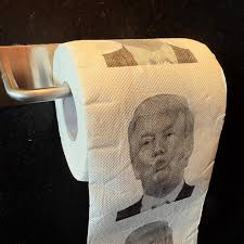 Roll of toilet paper with a printed face on a black background