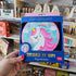 hand holding unicorn tambourine in shop