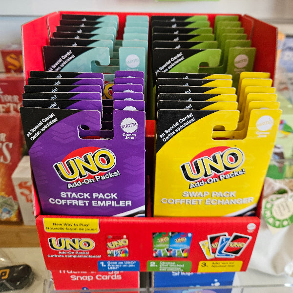 UNO Add-On Packs display with colourful Stack, Swap and other expansion packs in a retail box — Adventure Awaits