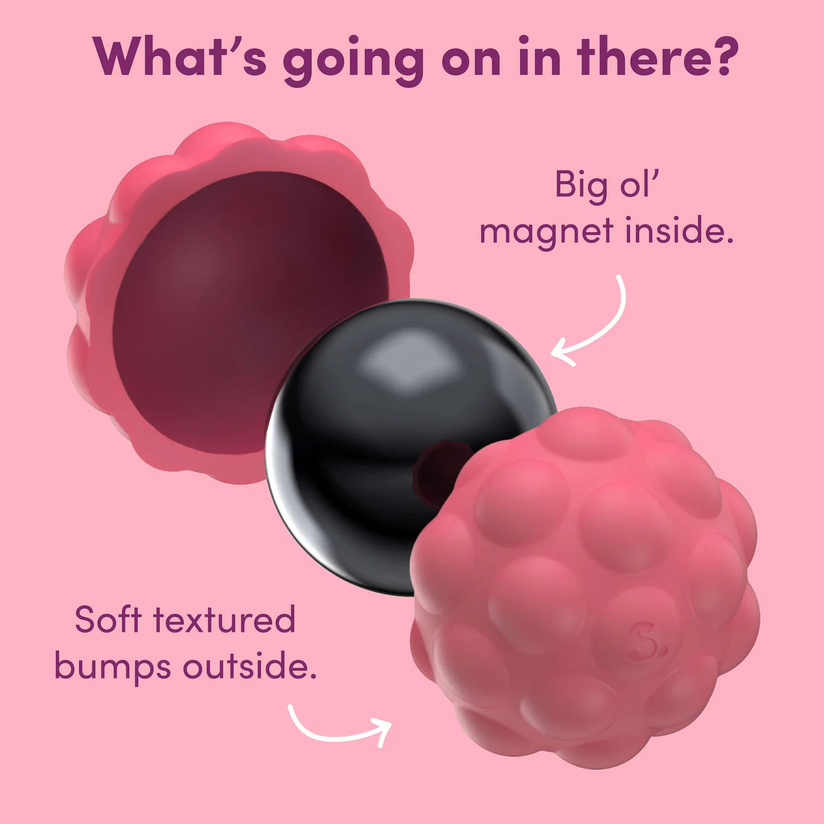 Pink textured ball with a black magnet inside on a pink background